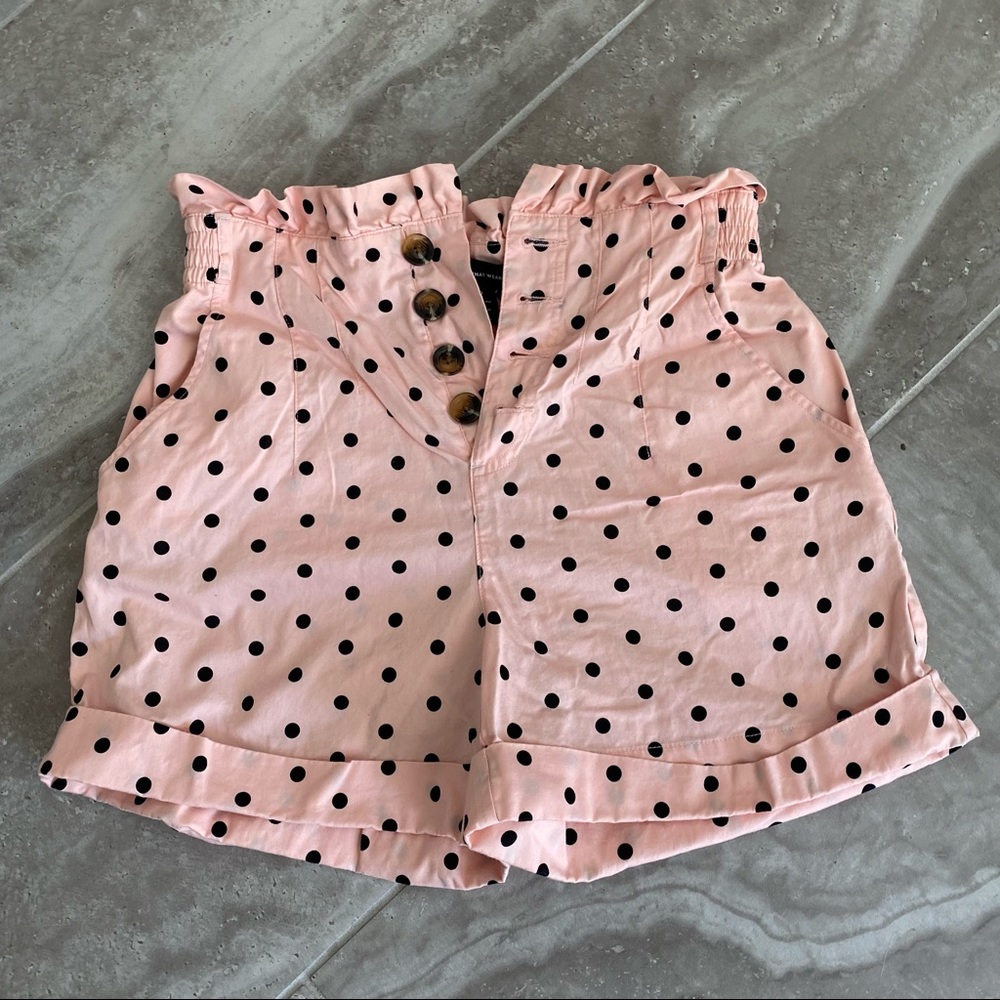 Highlight Waisted, pink and black polkadot shorts with ruffled top